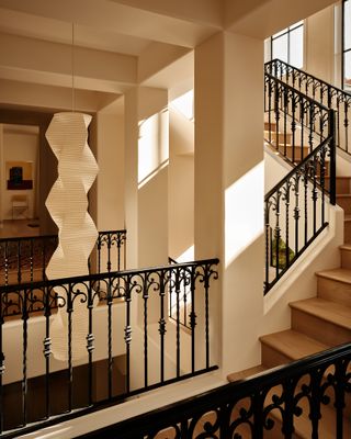 a large hallway with a paper noguchi style light fixture