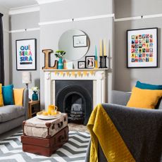 Grey living room with mirror on a picture rail
