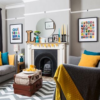 Grey living room with mirror on a picture rail