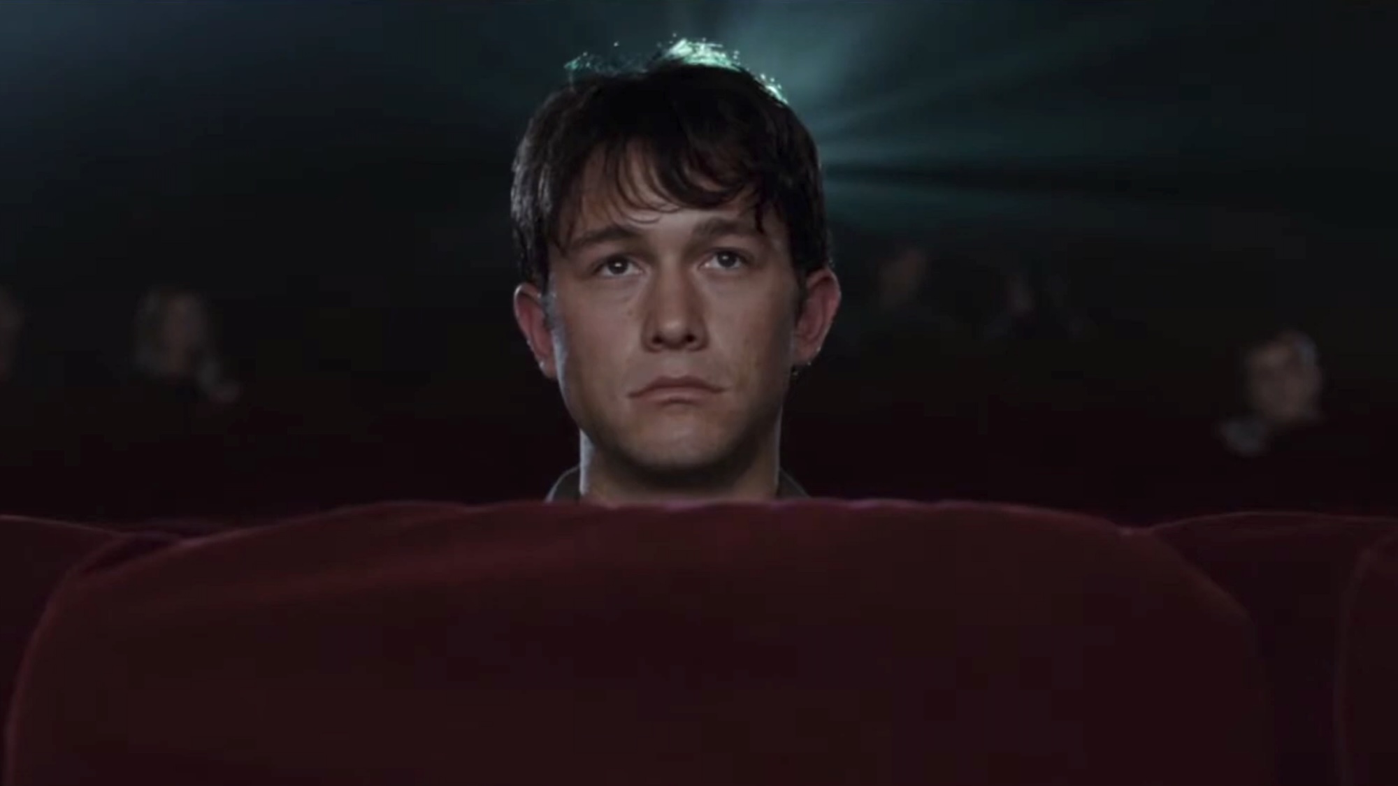 Tom watching a movie in 500 Days of Summer.