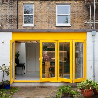 colourful budget renovation-yellow bifold doors