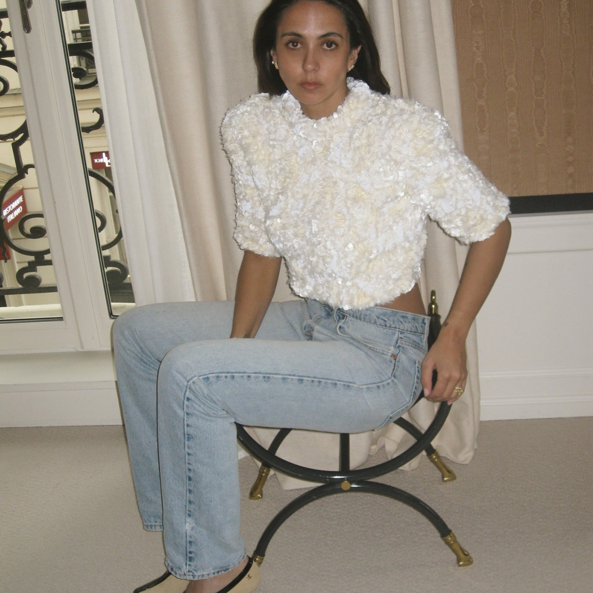 Hanna MW wearing vintage Levi's jeans with a sequin top and Chanel pumps in another. 