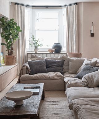 Small corner sofa with grey neutral color scheme