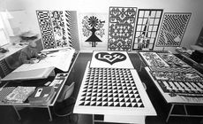 ﻿﻿Alexander Girard, famed textile designer and Herman Miller collaborator, at work in his studio