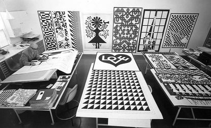 ﻿﻿Alexander Girard, famed textile designer and Herman Miller collaborator, at work in his studio