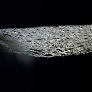 Although the lunar landing was canceled, the Apollo 13 spacecraft did circle around the moon as the crew struggled to make it back to Earth, and the astronauts were able to capture closeup images of the lunar surface. In this photo, the large International Astronomical Union Crater No. 221 sits at the center on the horizon with another large crater to the south known as IAU No. 220. The image shows part of the lunar surface southeast of Mare Moscoviense.