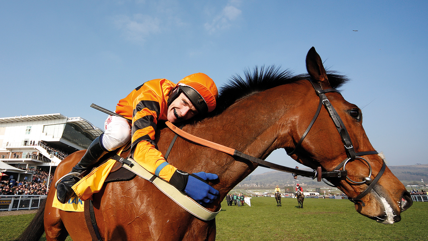 CHELTENHAM, ENGLAND - MARCH 17: Tom Scudamore riding Thistlecrack win The Ryanair World Hurdle Race during Cheltenham Festival - St Patrick's Thursday at Cheltenham racecourse on March 17, 2016 in Cheltenham, England.(Photo by Alan Crowhurst/Getty Images)