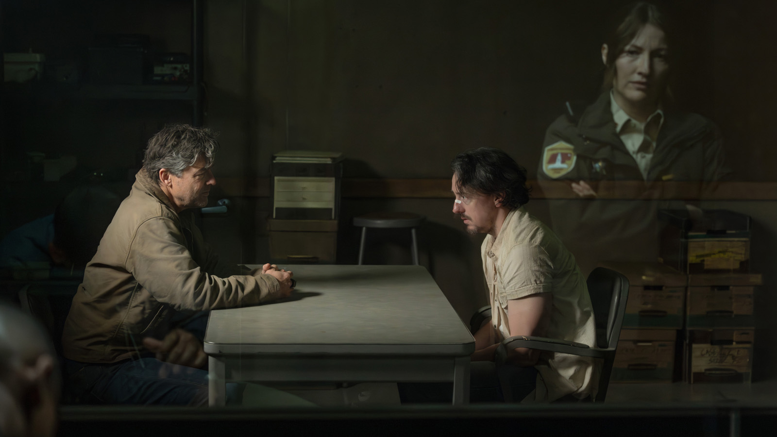 Hal Jordan interrogating a crook as Sheriff Kerry watches on in Lanterns episode 1