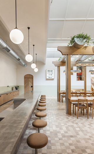 Restaurant dining area with hanging produce garden