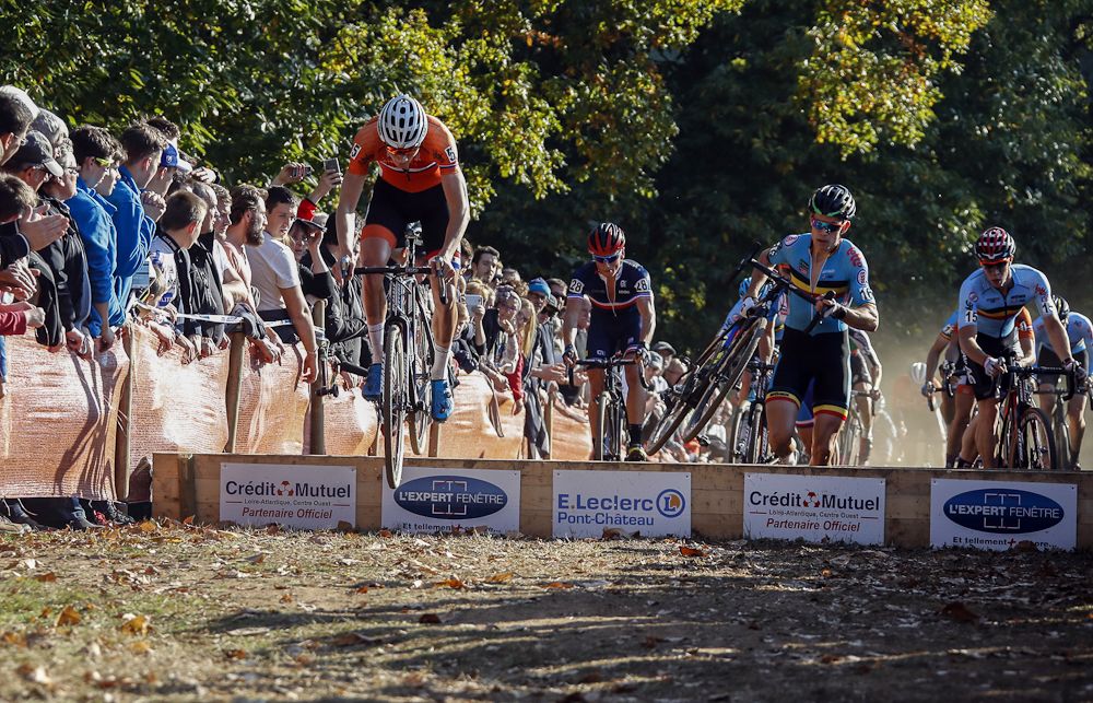 Mathieu Van Der Poel (Netherlands) and Wout Va Aert (Belgium) lead over the barriers