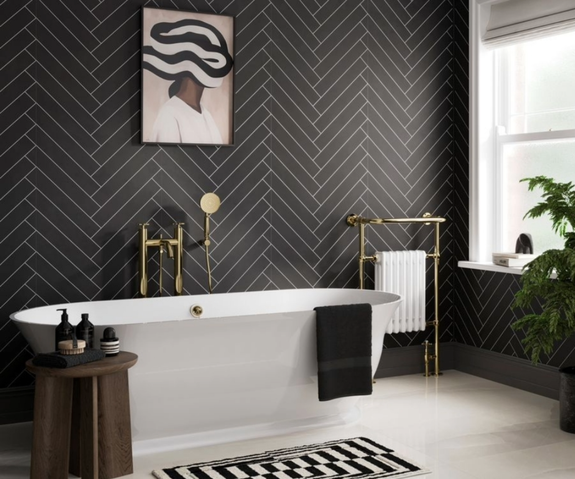 Dark bathroom idea with black and white wall tiles, white flooring and white freestanding bath