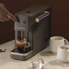 Hotel Chocolat Podster coffee machine creating a coffee