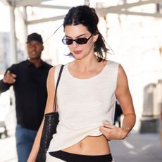 Kendall Kenner wearing a white tank and black pants in NYC