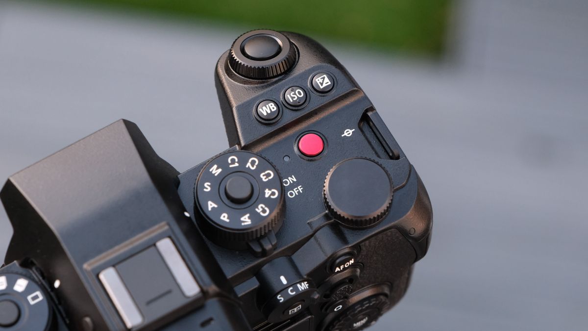 Close up of the dials and buttons on a Panasonic Lumix S1R II camera top panel