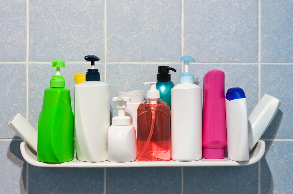 Various hygiene products on a bathroom shelf