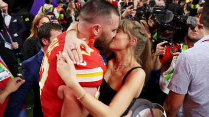 Travis Kelce and Taylor Swift kissing at the Super Bowl GettyImages-2004247308