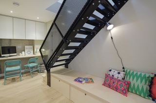 The industrial-style staircase sits in the middle of the floorplan. The bespoke staircase and balustrade cost £3,000.