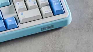 A white and blue Epomaker TH99 96% mechanical keyboard