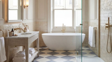 luxury bathroom with checkerboard marble floors, white zellige tile walls, and a freestanding tub