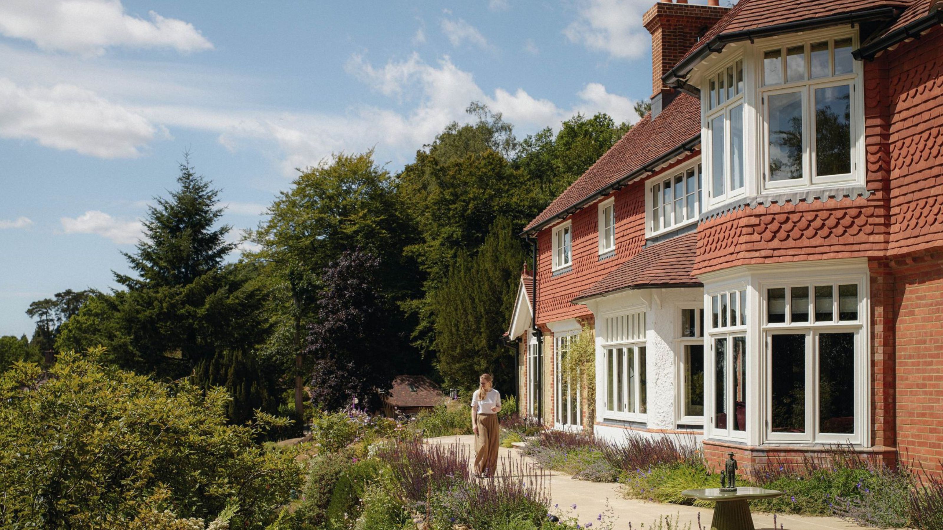 an arts and crafts style home perched atop the surrey hills