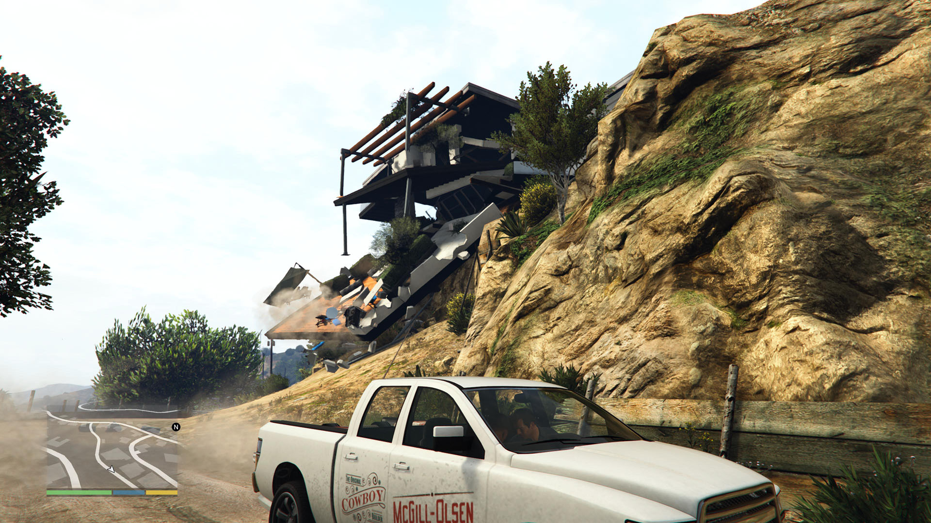 Franklin and Michael pull down a clifftop house in GTA 5 using a tow truck