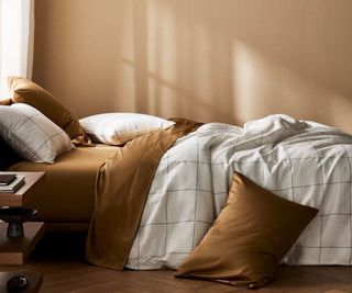 Brooklinen Luxe Duvet Cover on a bed.