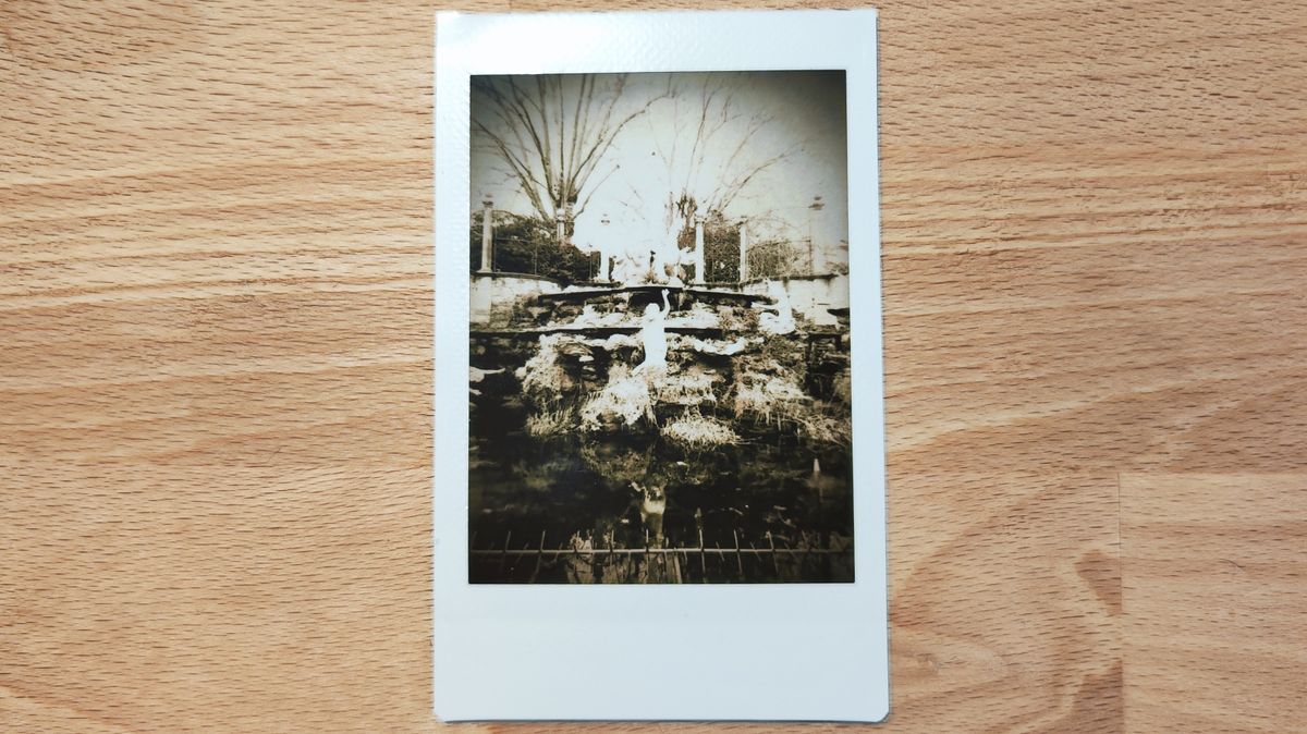 Instant photos on a wooden table