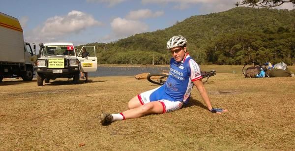 Aussie Chris Neal stretches by the lakeside