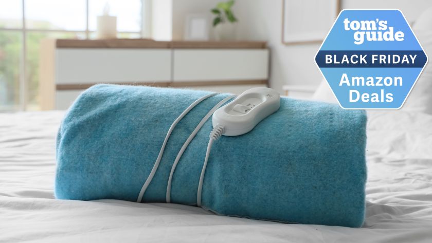 Heated blanket on a bed in airy room and Black Friday deal badge top right corner