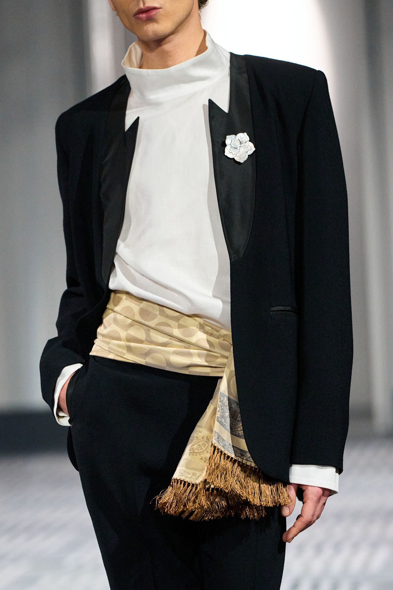 Conner Ives model wearing a cummerbund, a big fall 2026 micro-trend.