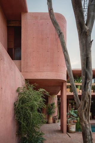 casa roja, a red house by angel garcia in mexico with indoor outdoor areas and terraces anda brutalist exposed concrete in red tone