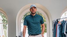 Harry Kane poses in Reflo golf gear