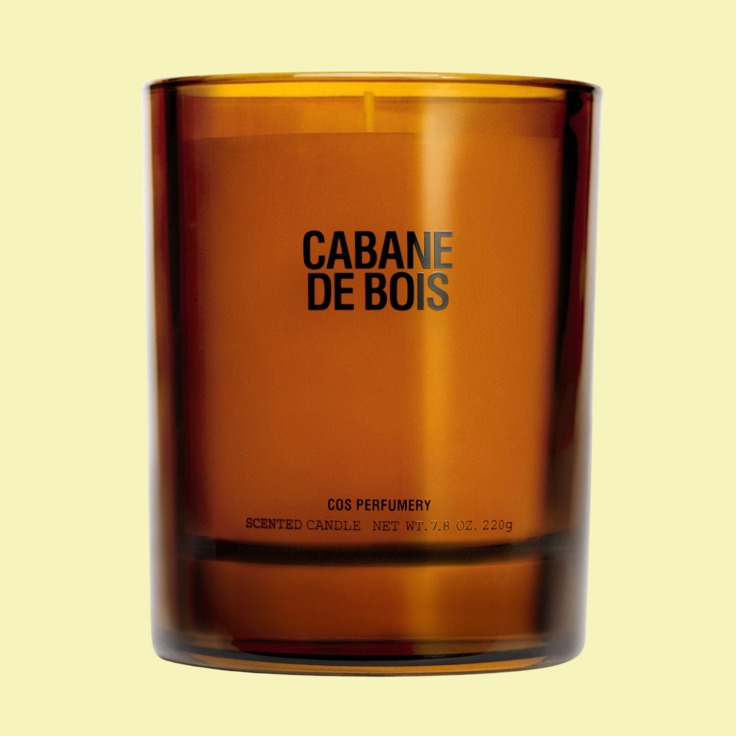 A candle in an amber glass