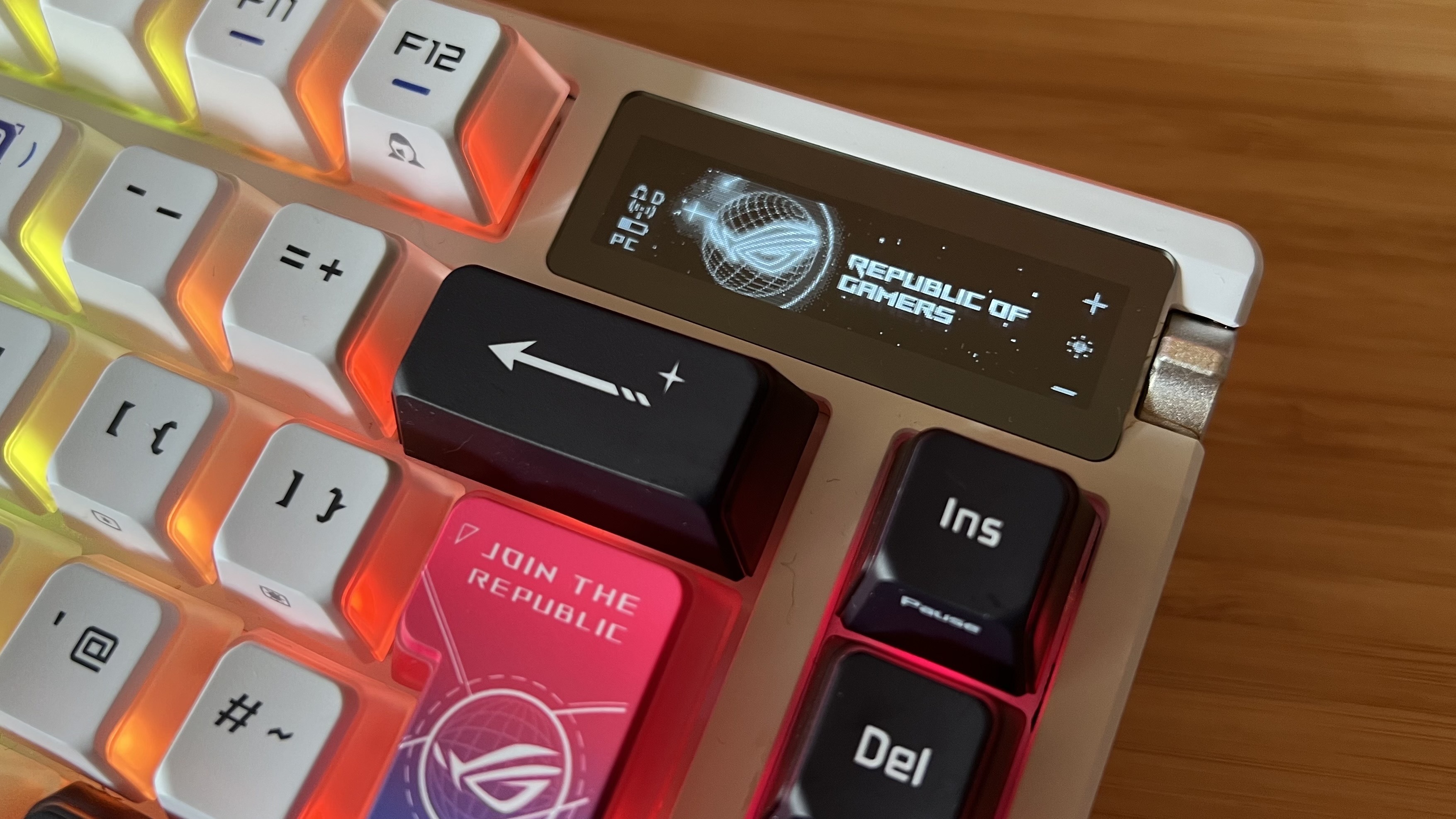 Close up on OLED display and control knob in top right corner of Asus ROG Azoth X gaming keyboard