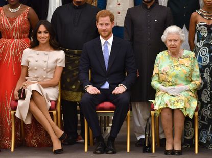 Prince Harry, Meghan Markle, and Queen Elizabeth II.