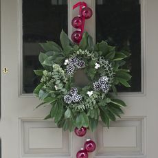 white door with wreath and baubles