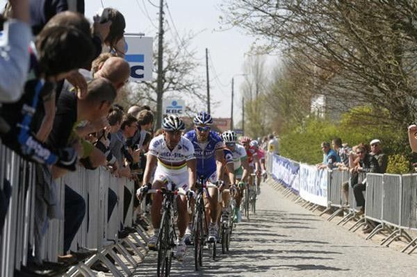 Paolo Bettini leads the chase ahead of Boonen
