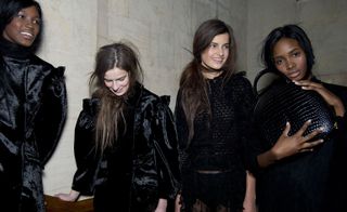 four male models wearing black clothing by simone rocha