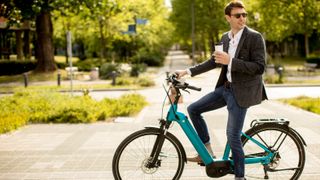 An ebike commuter enjoying a coffee