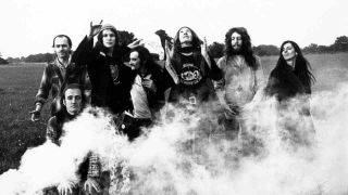 Gong standing in a field in front of a smoke flare in 1974