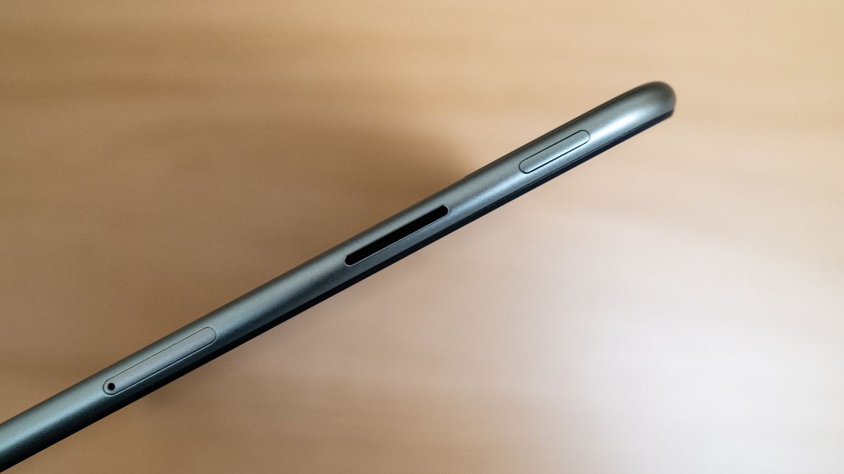 OnePlus Pad Go side on view of the Micro SD slot on a wooden table
