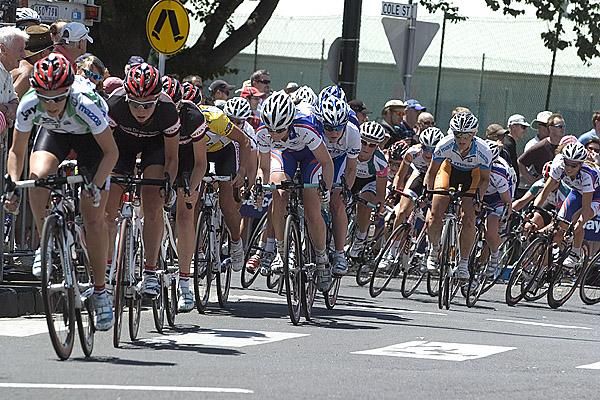 Riders in the women's race head out of a roundabout in Nelson Parade.