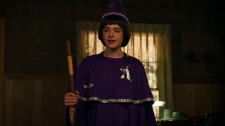 Noah Schnapp as Will Byers wearing the purple Wizard outfit in Season 3 of Stranger Things