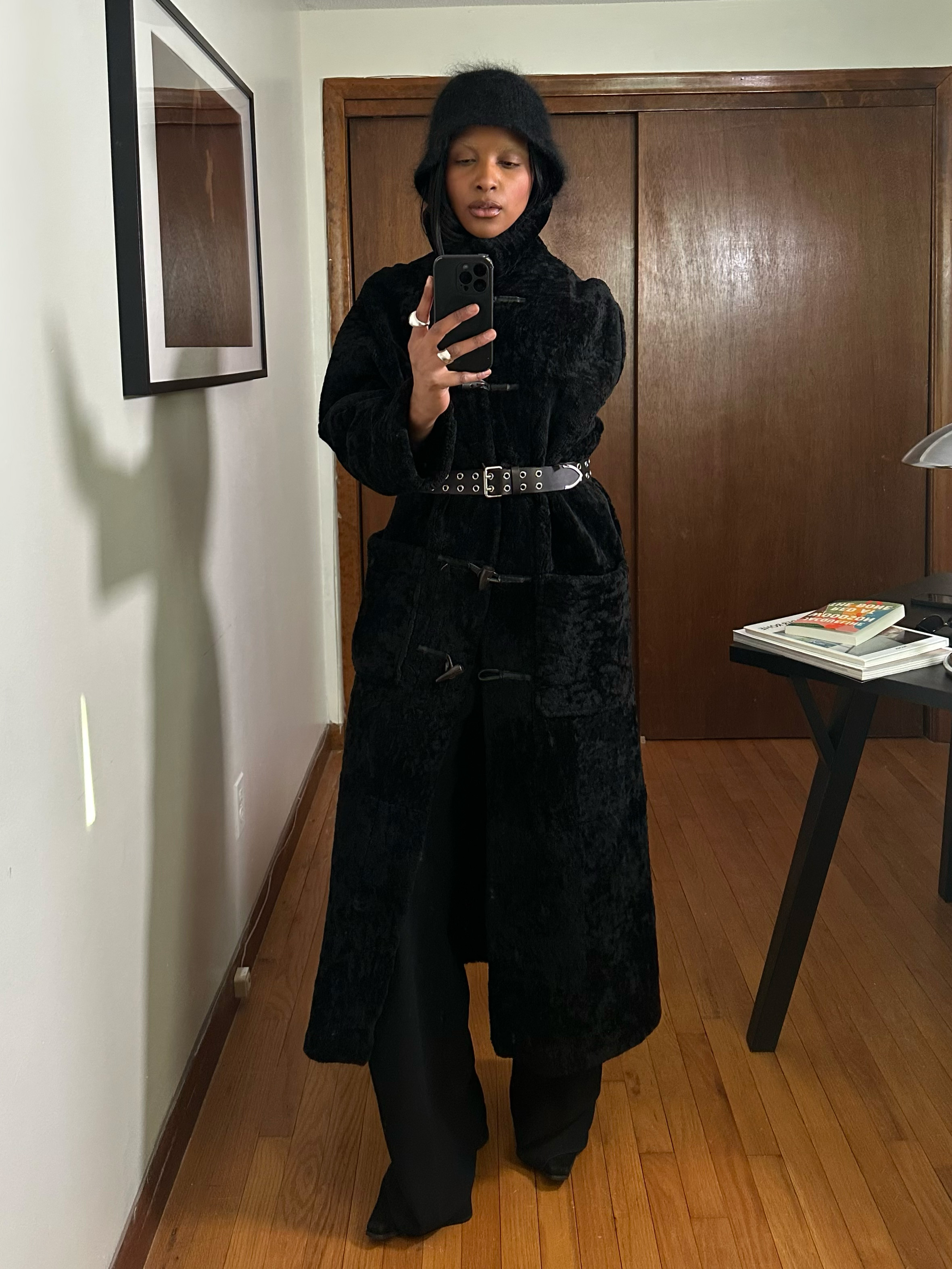 Maya Moore wearing a black studded belt over a faux fur coat