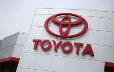 Toyota dealership sign on the side of a building