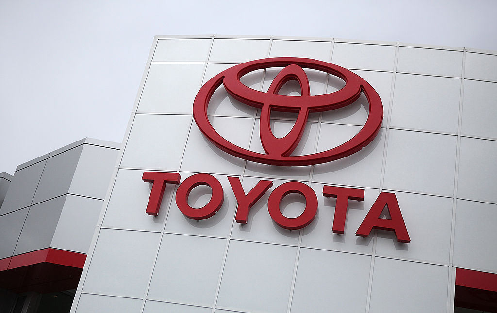 Toyota dealership sign on the side of a building