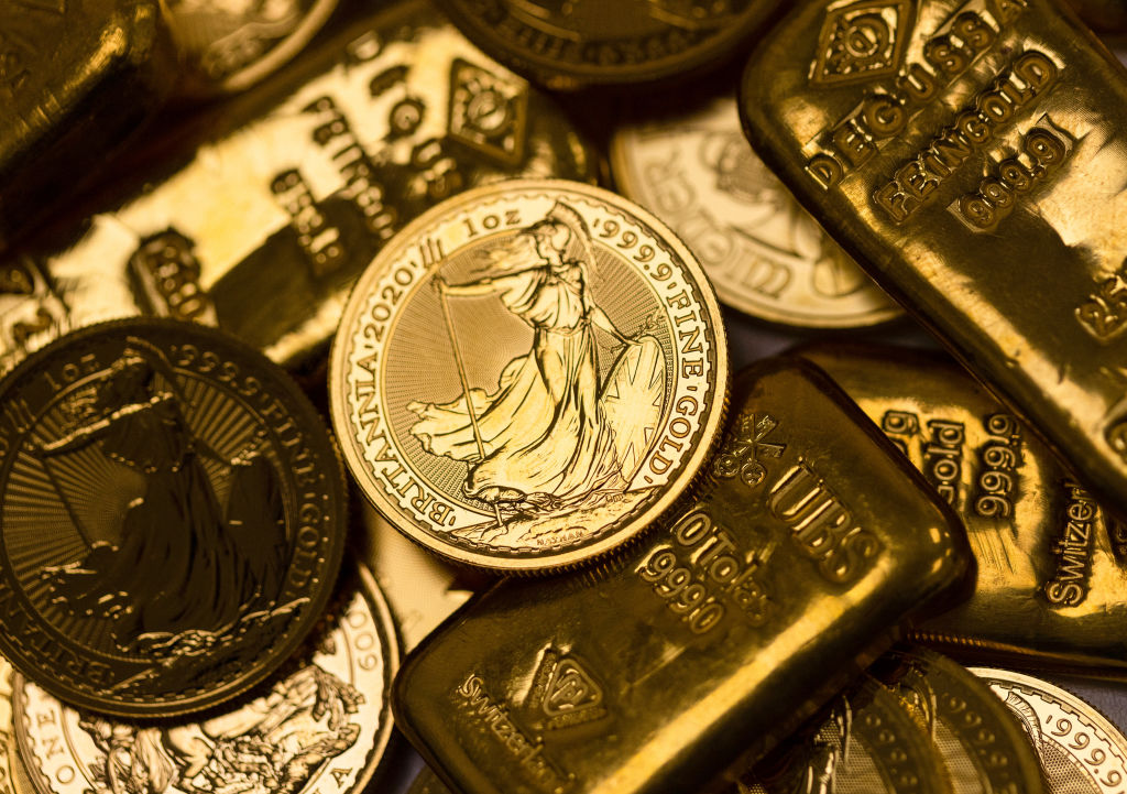 A selection of various weighted gold bars and coins