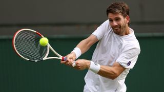 Cameron Norrie of Great Britain plays a backhand against Tommy Paul of The United States