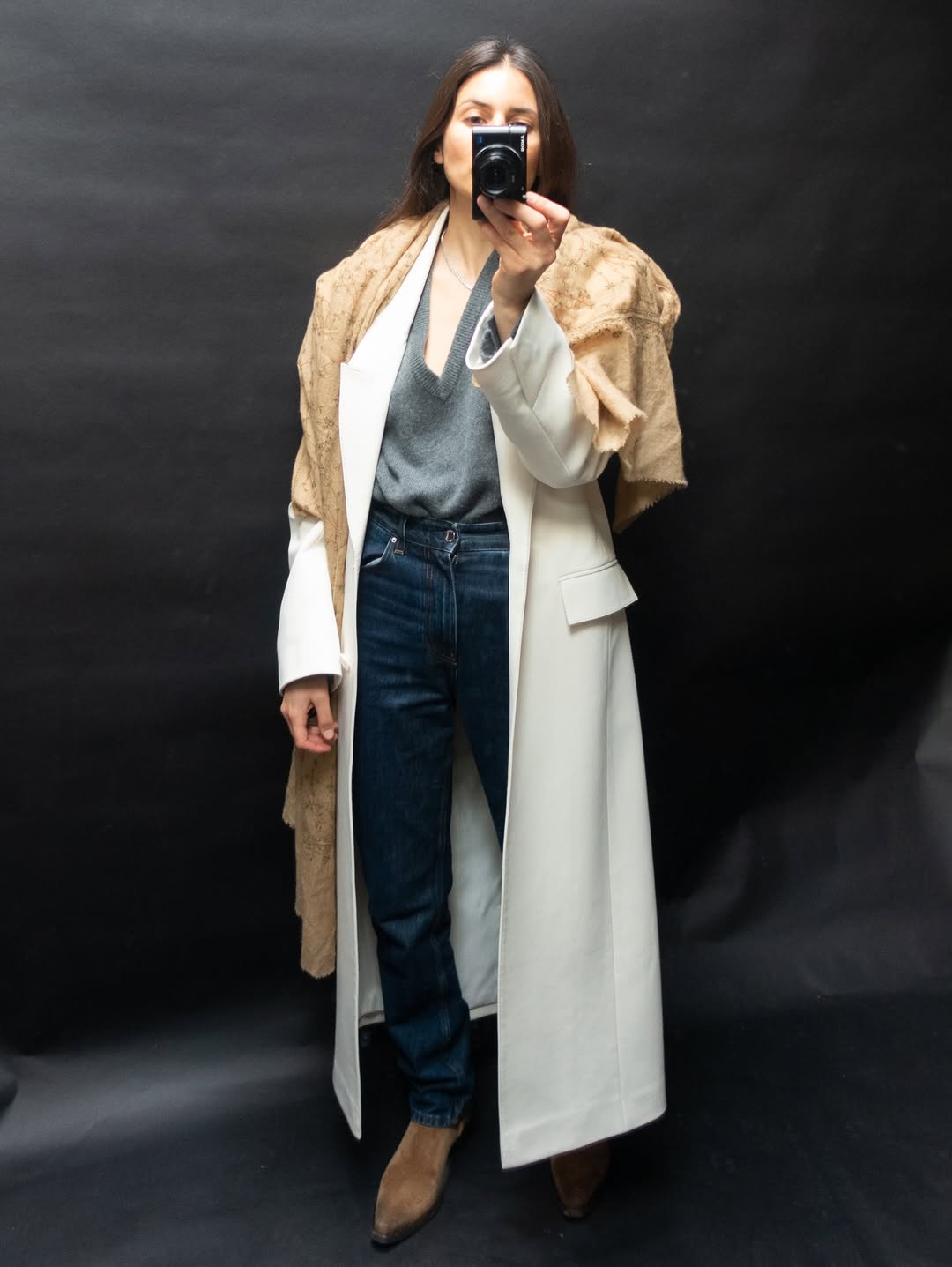 woman wearing gray sweater spring outfit 2026