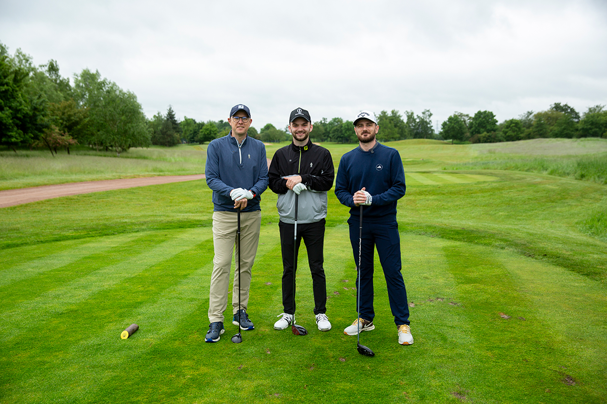 Neil Tappin, Dan Parker and Barry Plummer having a photo together as playing partners at the Prostate Cancer UK Big Golf Race charity day at Burhill Golf Club